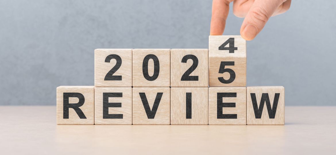 2025 review new year. hand turns wooden cube and changes number Review 2024 to Review 2025. Business, 2025 review new year concept. gray background, copy space.