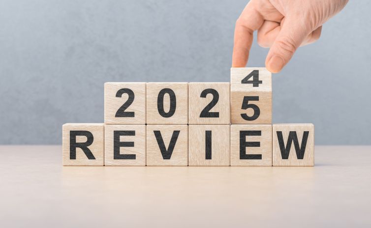 2025 review new year. hand turns wooden cube and changes number Review 2024 to Review 2025. Business, 2025 review new year concept. gray background, copy space.