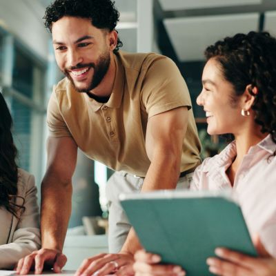 Laughing, meeting and colleagues with tablet, collaboration and humor for project, group and office. Happy, marketing coordinator and people with tech for campaign, teamwork and employees with jokes